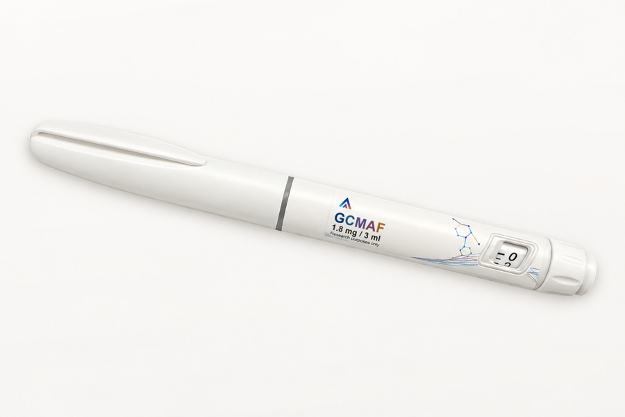 White Aevamere GcMAF pen labelled 1.8 mg / 3 ml, angled on an ivory studio surface.
